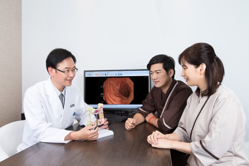 Doctor reviewing endoscopy images with guests during a Taipei health screening