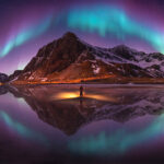 Aurora borealis arching over a mountain at Lofoten, Norway, the Southeast Asia Open winner at the Pano Awards 2026