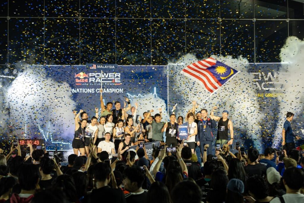 Malaysia celebrates the Nations’ Trophy on stage as confetti falls over the crowd