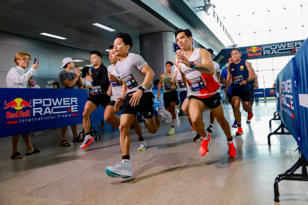 Male athletes power through a 400m run during the Red Bull Power Race in Bangkok