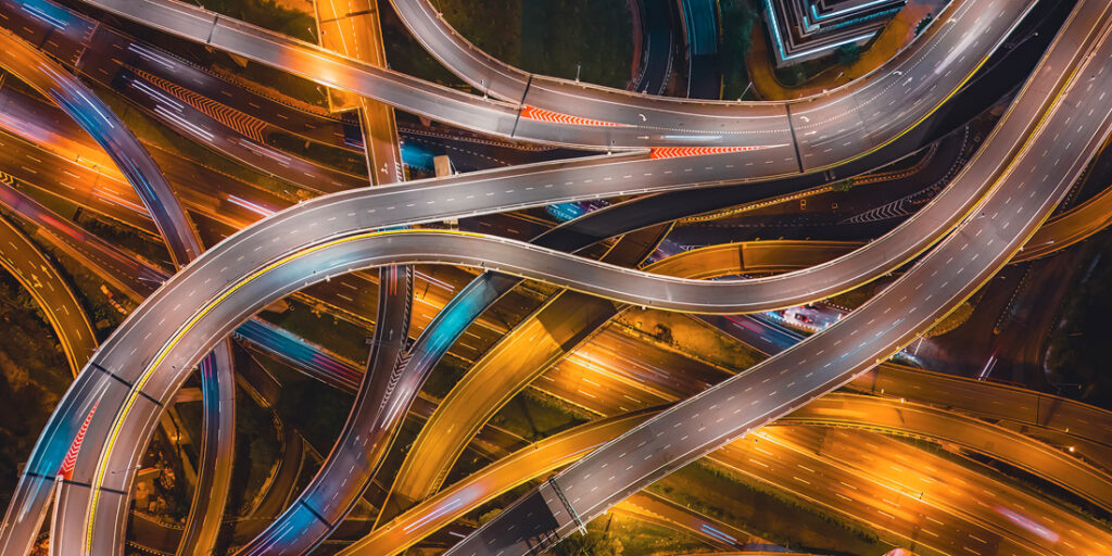 Aerial night view of elevated highway interchanges in Damansara, Malaysia